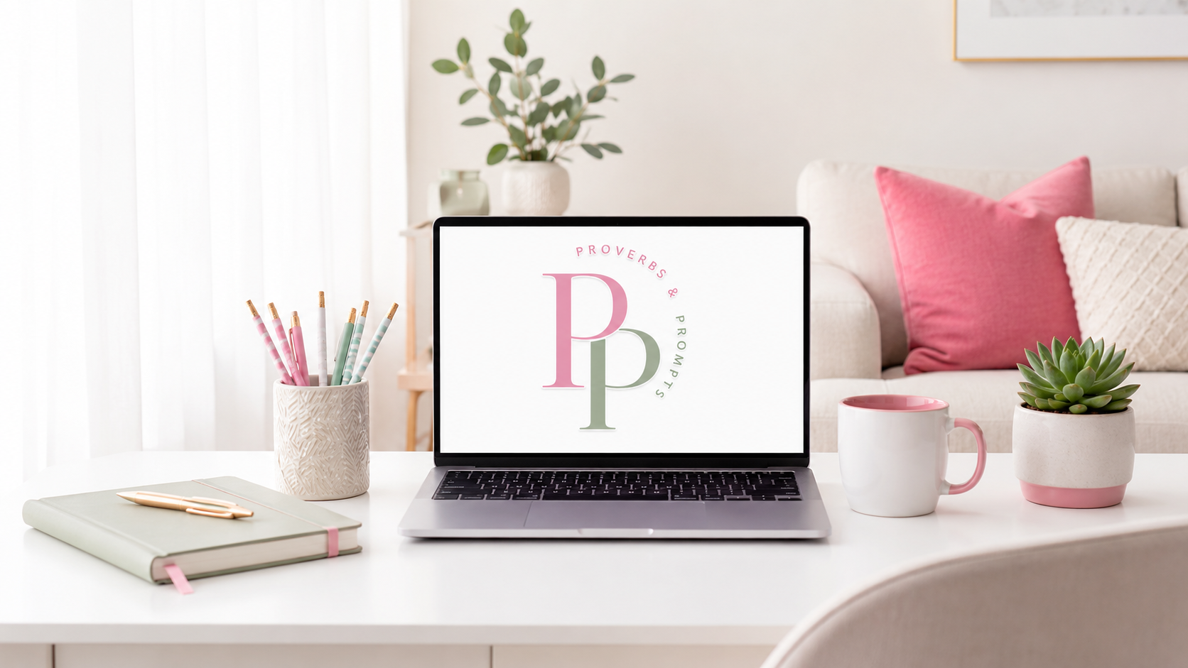 Proverbs & Prompts logo displayed on a laptop in a bright home office with pink and green accents.